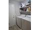 A laundry room featuring a side-by-side washer and dryer and shelving at 824 Holly Lake Way, Henderson, NV 89002