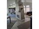 Open floor plan showcasing a decorative fireplace and seamless connection to the kitchen at 824 Holly Lake Way, Henderson, NV 89002