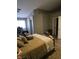 Cozy main bedroom featuring hardwood floors, ceiling fan, and plenty of closet space at 824 Holly Lake Way, Henderson, NV 89002