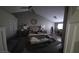 Bright bedroom with hardwood floors, ceiling fan, a seating area, and plenty of storage at 824 Holly Lake Way, Henderson, NV 89002