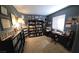 This home office boasts a wall of books and collections for those looking for a dedicated workspace at 824 Holly Lake Way, Henderson, NV 89002