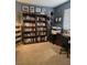 This office features blue walls, two bookshelves, and a Broadway street sign at 824 Holly Lake Way, Henderson, NV 89002