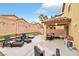 Large backyard boasts a covered patio, lounge seating, and ample space for outdoor enjoyment at 8329 Brilliant Ruby Ct, Las Vegas, NV 89139