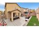 Spacious backyard featuring a covered patio, lawn area, and privacy fencing at 8329 Brilliant Ruby Ct, Las Vegas, NV 89139