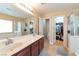 Bathroom featuring dual sinks, shower, bathtub, and walk-in closet at 8329 Brilliant Ruby Ct, Las Vegas, NV 89139