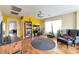 Inviting living room with hardwood floors, a workspace, and bright, natural light at 8329 Brilliant Ruby Ct, Las Vegas, NV 89139