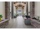 Elegant lobby featuring stone columns, tiled floors, beamed ceiling, and a welcoming reception area at 9050 W Warm Springs Rd # 1093, Las Vegas, NV 89148