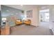 Cozy bonus room featuring unique wall decor, two chairs, and gray carpeting at 9359 Jade Mesa St # Lot 51, Las Vegas, NV 89139