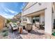 Backyard patio featuring comfortable seating, a fire pit, and pavers at 9380 Lunar Effect St, Las Vegas, NV 89143