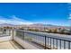 Balcony view showcases a mountain range with other houses in the neighborhood at 9380 Lunar Effect St, Las Vegas, NV 89143