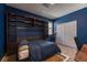 Cozy bedroom with a custom built-in storage unit, and a stationary bike at 9380 Lunar Effect St, Las Vegas, NV 89143