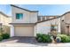 Modern two-story home with a two-car garage and desert landscaping at 9380 Lunar Effect St, Las Vegas, NV 89143
