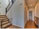 Hallway with staircase, wood floors, and doors leading to other rooms in the house at 9380 Lunar Effect St, Las Vegas, NV 89143