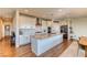 Spacious kitchen with white cabinets, stainless appliances, and a large island at 9380 Lunar Effect St, Las Vegas, NV 89143