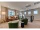 Second-story living room with a comfortable sofa, and natural lighting at 9380 Lunar Effect St, Las Vegas, NV 89143