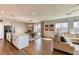 Open-concept living space with kitchen island, dining area, and comfortable living room at 9380 Lunar Effect St, Las Vegas, NV 89143