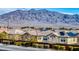 Rooftop solar panels highlight homes in a desert community with mountain views at 9380 Lunar Effect St, Las Vegas, NV 89143