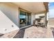 Covered patio area with sleek sliding glass doors and outdoor dining set, perfect for entertaining at 9380 Lunar Effect St, Las Vegas, NV 89143