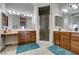 Bright bathroom with a walk-in shower, dual sink vanities, and recessed lighting at 9508 Wakashan Ave, Las Vegas, NV 89149