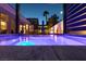 Gorgeous pool and hot tub featuring accent lighting and a covered patio, ideal for warm nights at 9508 Wakashan Ave, Las Vegas, NV 89149