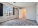 Carpeted bedroom with walk-in closet and large window at 10115 Tree Bark St, Las Vegas, NV 89183