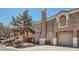Inviting home exterior with a private garage and mature landscaping at 10115 Tree Bark St, Las Vegas, NV 89183