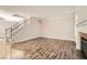 Spacious living room featuring hardwood floors and staircase access at 10115 Tree Bark St, Las Vegas, NV 89183