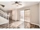 Bright living area with hardwood floors and a sliding glass door at 10115 Tree Bark St, Las Vegas, NV 89183