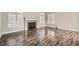Beautiful living room with modern hardwood floors and a cozy fireplace at 10115 Tree Bark St, Las Vegas, NV 89183