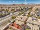 Desirable home featuring a covered patio, a rooftop deck, and lush landscaping in a picturesque community at 10490 Palmadora St, Las Vegas, NV 89178