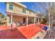 Covered backyard patio with outdoor furniture, BBQ, lush trees, and mature landscaping at 10490 Palmadora St, Las Vegas, NV 89178