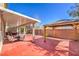 Backyard with covered patio, outdoor furniture, fire pit, BBQ, mature landscaping, and gazebo at 10490 Palmadora St, Las Vegas, NV 89178