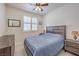 Inviting bedroom with a plush bed, shuttered windows, and a dresser and nightstand at 10490 Palmadora St, Las Vegas, NV 89178