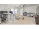 Bonus room setup as an office, featuring bright lighting and comfortable seating at 10490 Palmadora St, Las Vegas, NV 89178