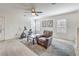 Relaxing bonus room setup as an exercise area, featuring bright lighting and comfortable seating at 10490 Palmadora St, Las Vegas, NV 89178