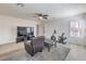 Relaxing bonus room setup as an exercise area, featuring bright lighting and comfortable seating at 10490 Palmadora St, Las Vegas, NV 89178