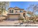 Charming two-story home featuring a neutral color palette, a two car garage, and manicured front yard at 10490 Palmadora St, Las Vegas, NV 89178