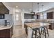Modern kitchen boasts granite countertops, stainless steel appliances, and wood flooring at 10490 Palmadora St, Las Vegas, NV 89178
