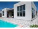 Beautiful backyard with a pool, patio, and sleek, modern home design at 10921 Rossa Peak Ave, Las Vegas, NV 89135