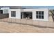 Contemporary home with a fenced yard, dining area, and desert landscaping at 10921 Rossa Peak Ave, Las Vegas, NV 89135