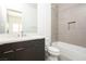 Bathroom features a modern vanity, bathtub with neutral tile, and updated fixtures at 10921 Rossa Peak Ave, Las Vegas, NV 89135