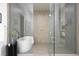 Contemporary bathroom features a glass shower enclosure and stylish soaking tub at 10921 Rossa Peak Ave, Las Vegas, NV 89135