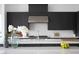 Modern kitchen with a large island, stainless steel appliances, and stylish dark cabinetry at 10921 Rossa Peak Ave, Las Vegas, NV 89135
