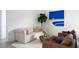 Inviting living room featuring a neutral sofa, brown leather chairs, and stylish decor at 10921 Rossa Peak Ave, Las Vegas, NV 89135