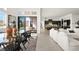 Open concept living space seamlessly connects the dining room, living room, and kitchen at 10921 Rossa Peak Ave, Las Vegas, NV 89135