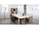 A modern office space with a marble desk, stylish chairs, and ample natural light at 10921 Rossa Peak Ave, Las Vegas, NV 89135
