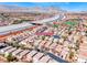 Wide aerial shot showing the neighborhood with mountain views and nearby freeway access at 11028 Meadow Leaf Ave, Las Vegas, NV 89144