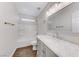 Bright bathroom features a shower-tub, large vanity, and modern fixtures at 11028 Meadow Leaf Ave, Las Vegas, NV 89144