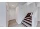 Bright stairway with modern wood-look flooring and white walls leading to the next floor at 11028 Meadow Leaf Ave, Las Vegas, NV 89144