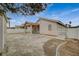 Side view of a cozy backyard featuring a covered patio, storage shed, and privacy fencing at 1115 Pearl Marble Ave, North Las Vegas, NV 89081